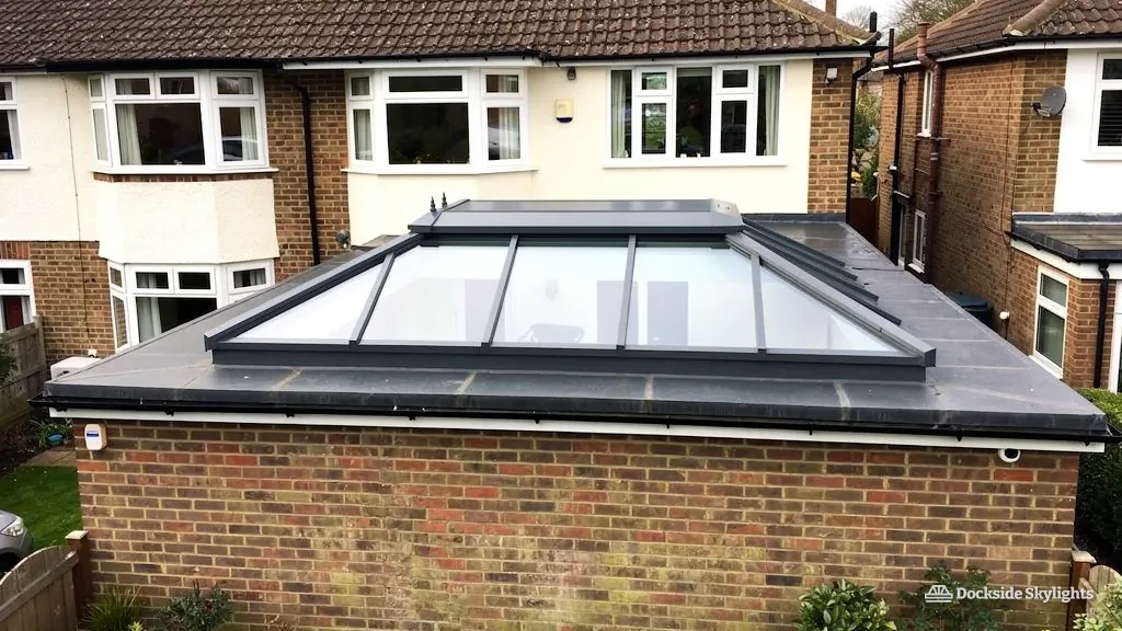 Roof lantern on a brick rear extension behind a rendered 1930s semi